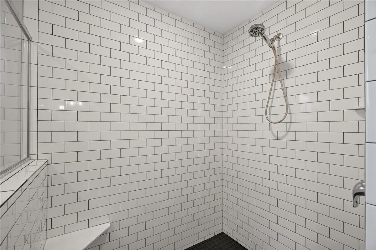 Over-sized shower with tile to the ceiling