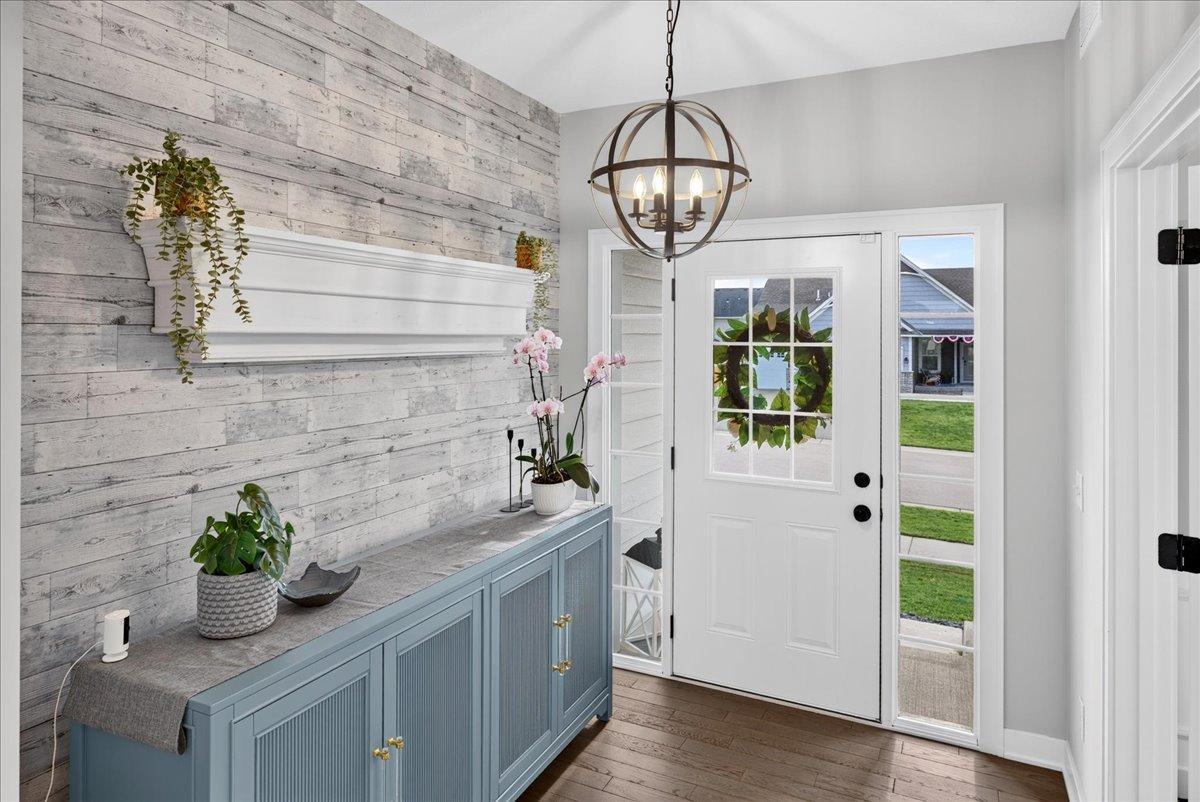 A warm welcome for your guests. Solid wood floors and wall paper feature wall.
