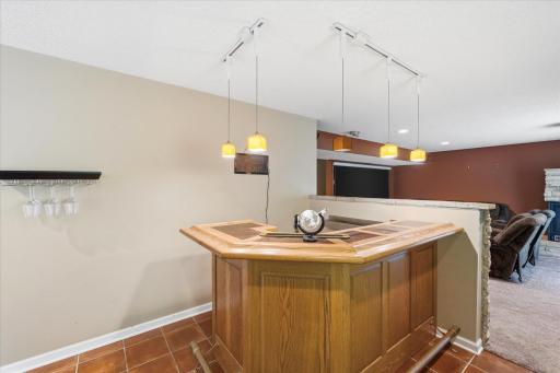 Dedicated bar area designed for entertaining and gathering.