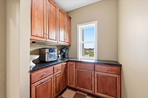 Butler's pantry enhances kitchen functionality and convenience.