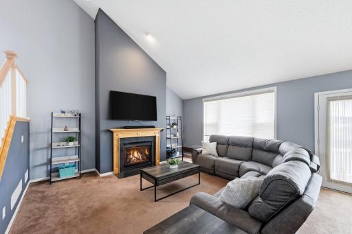 Vaulted ceilings and expansive windows create a bright, open atmosphere.