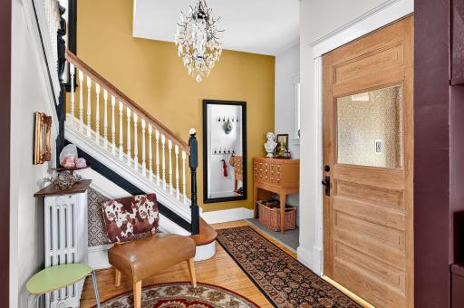 foyer with charming handrail to 2nd floor