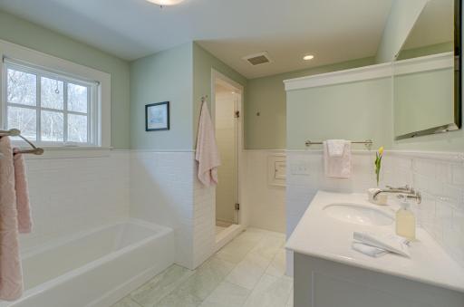 Enjoy the best of both worlds in this stunning full bath with a walk-in shower and separate tub for ultimate comfort