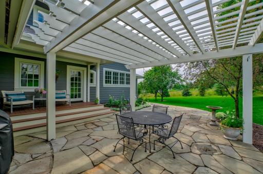 Relax in the screened in porch or step outside to enjoy your ownÂ quiet oasis on bluestone patio surrounded by mature maples and crab trees