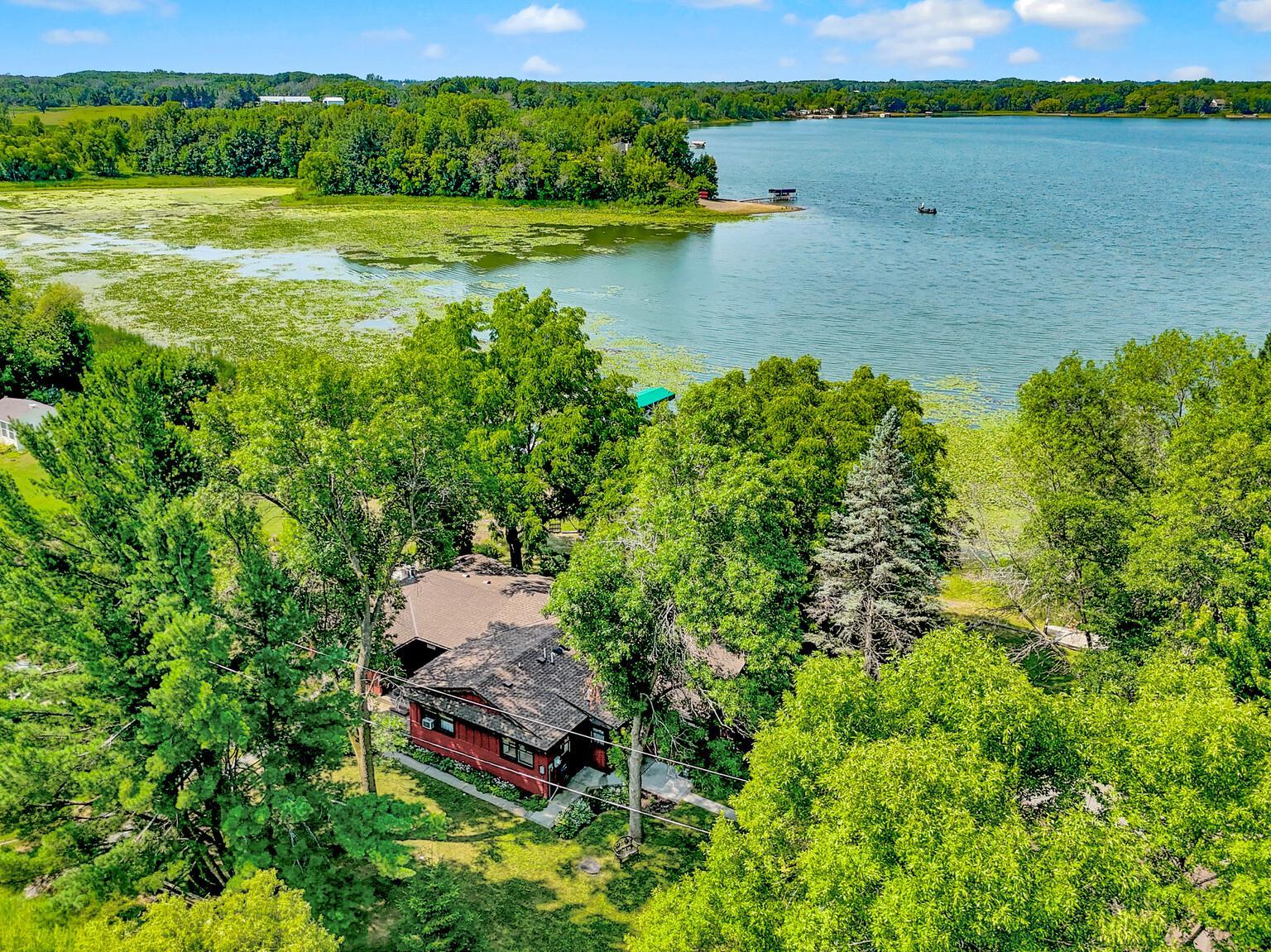 One level lake home nestled on a 150'+ wide lot on full recreation chain of lake.