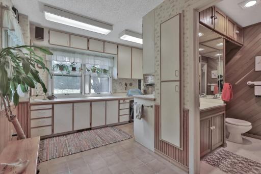 Laundry and hobby room, trap door to basement under rug in this room.