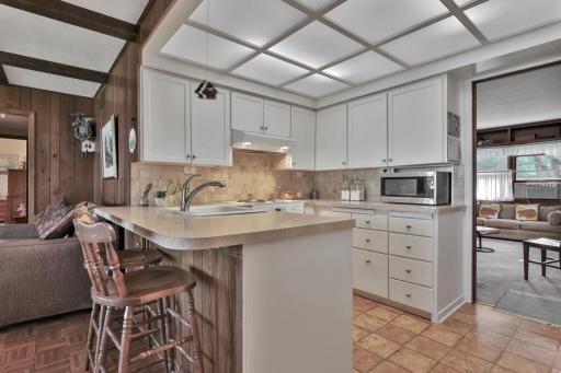 Compact kitchen area with ample lighting.