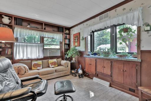 Den with ample cupboard space.