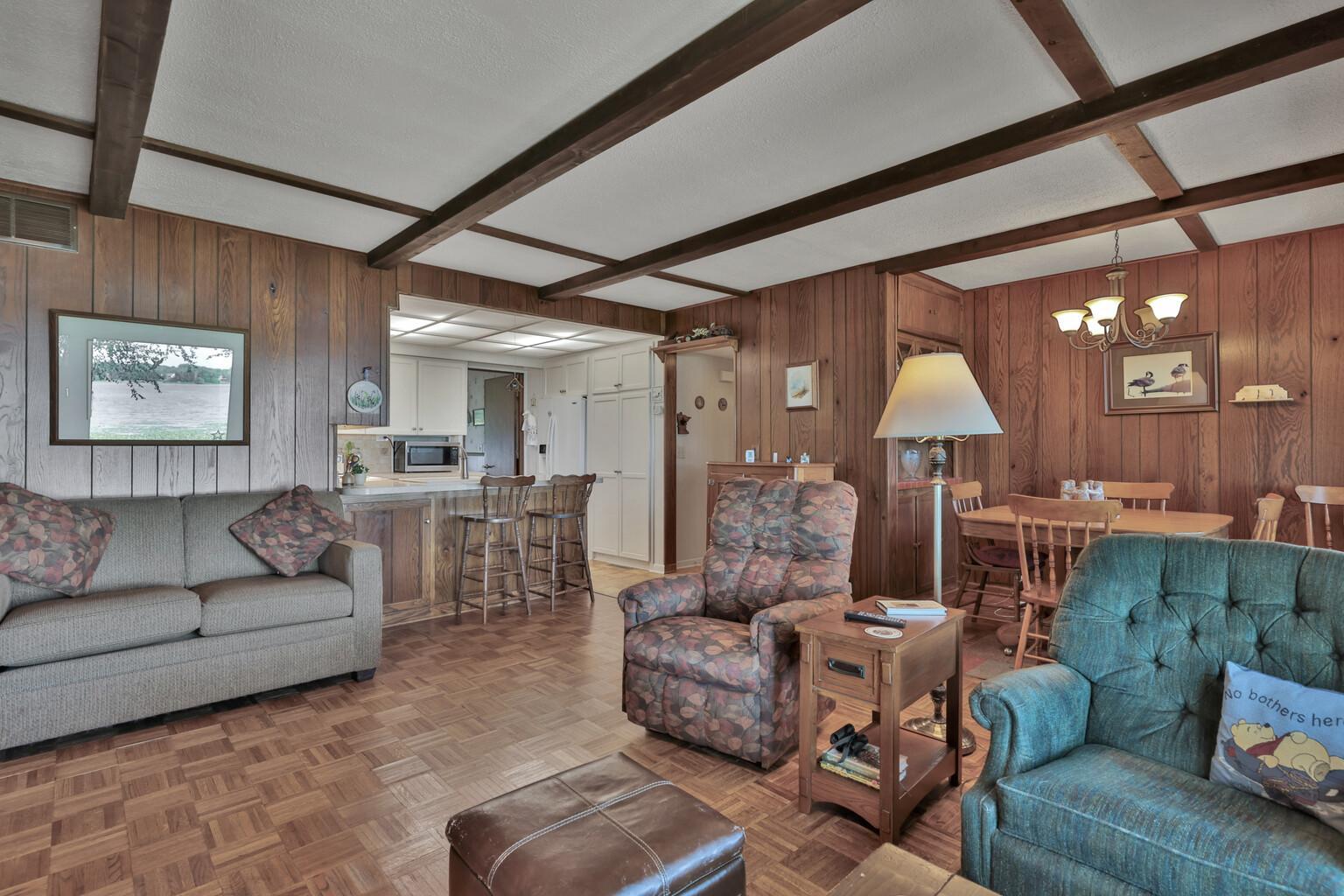 Dining to the right, kitchen to the center left from the living room.