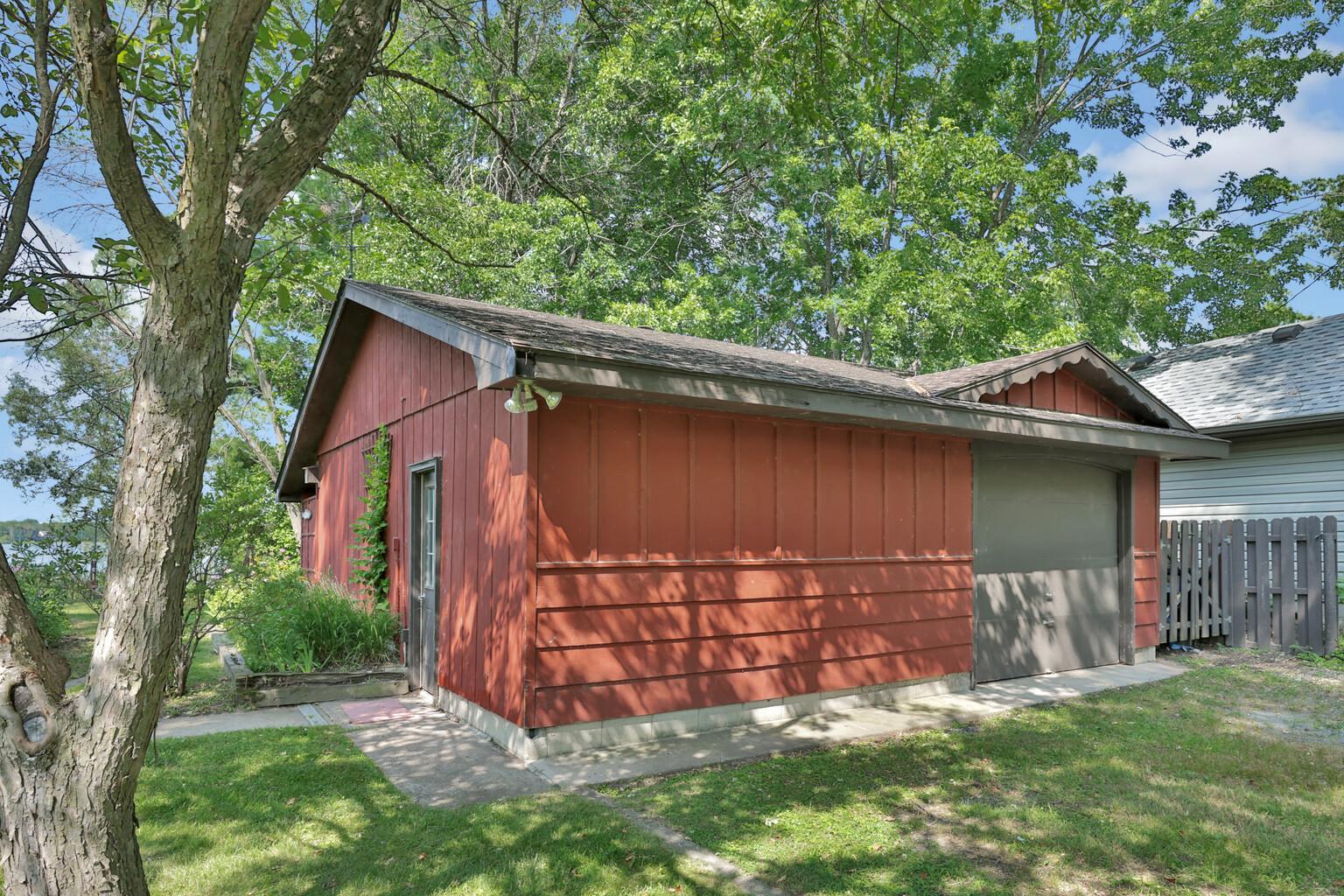 Detached 26' x 26' garage with lean-to at lake side.