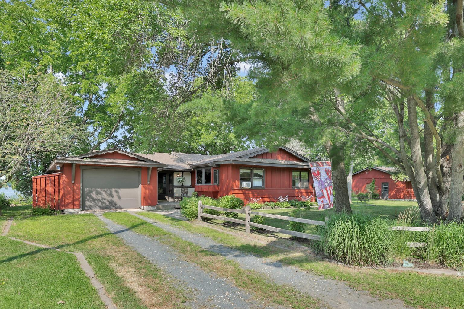 14' wide garage and split rail fence at street.