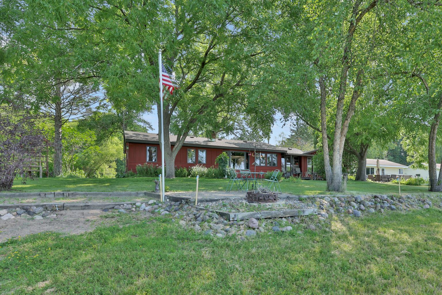 Fire ring and flag pole at lake side.