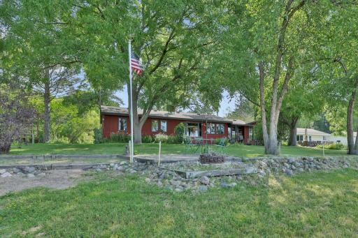 Fire ring and flag pole at lake side.