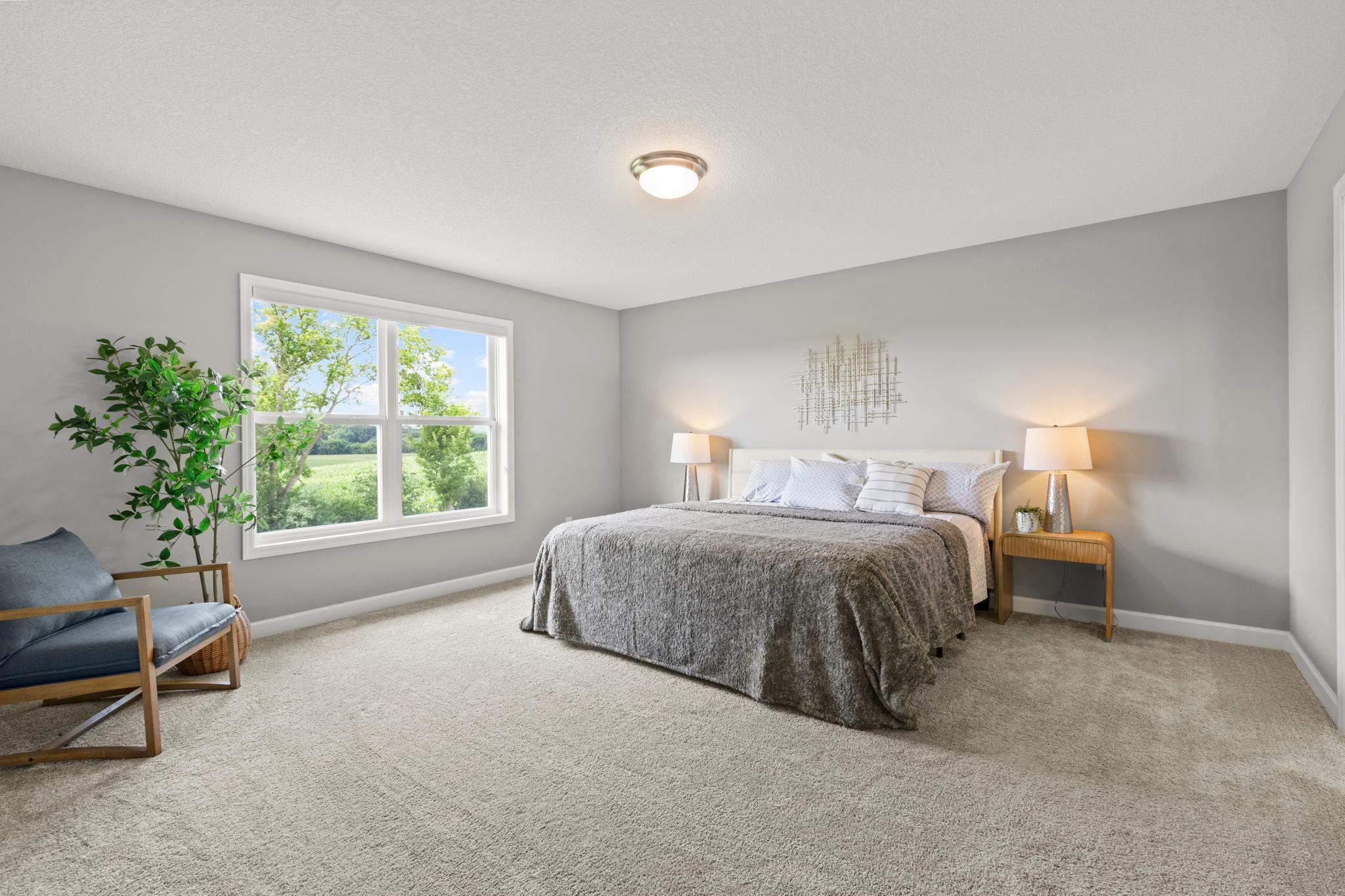 Upstairs, you'll find four generously sized bedrooms, including a spacious primary suite featuring carpeting and abundant natural light.