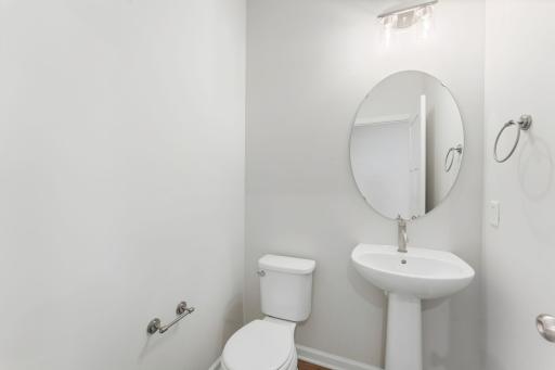 Powder bath on the main level. Photo of model home; Options and finishes may vary.