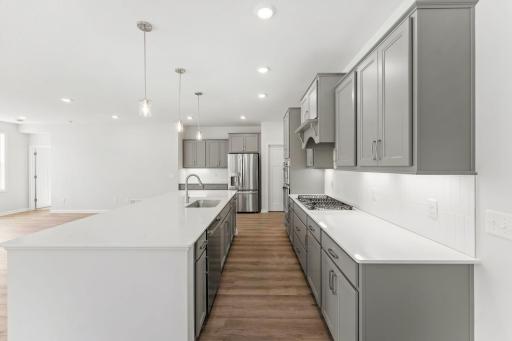 The center island is huge and perfect for entertaining, and preparing and serving food! Photo of model home; Options and finishes may vary.