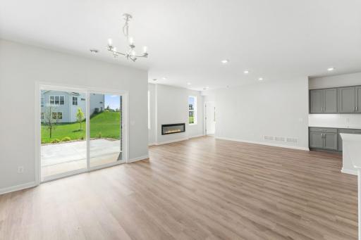 View standing in dining area, with view into family room.
