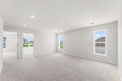 The upstairs of the home features an oversized loft, 2 additional bedrooms, and a full bathroom.
