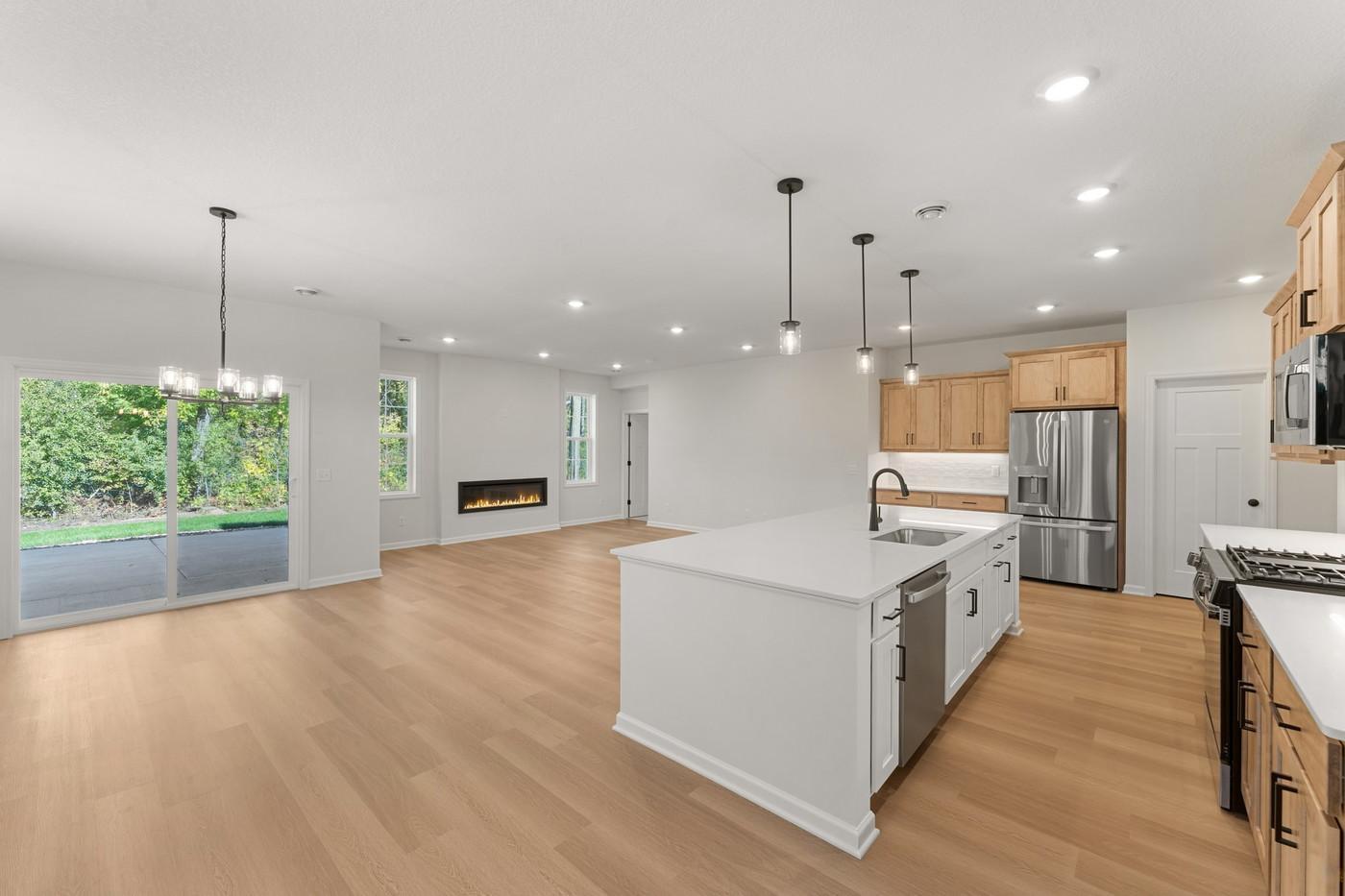 Open concept kitchen/dining/family room with sliding door to your patio!