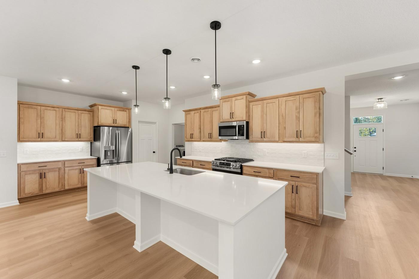 An entertainer's dream! Kitchen has a massive center island.