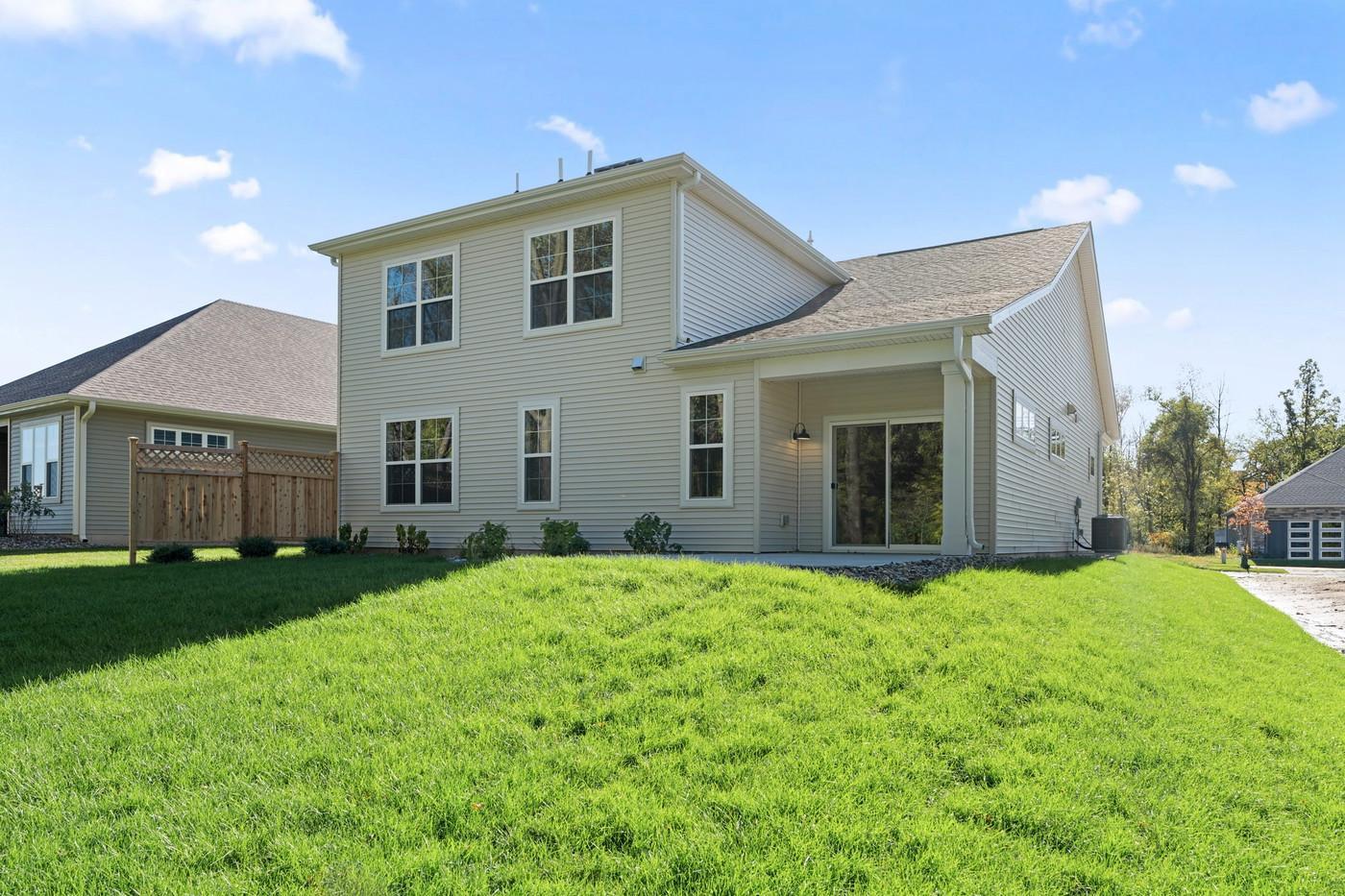 Exterior of home - part of the patio is covered! Privacy fence included.