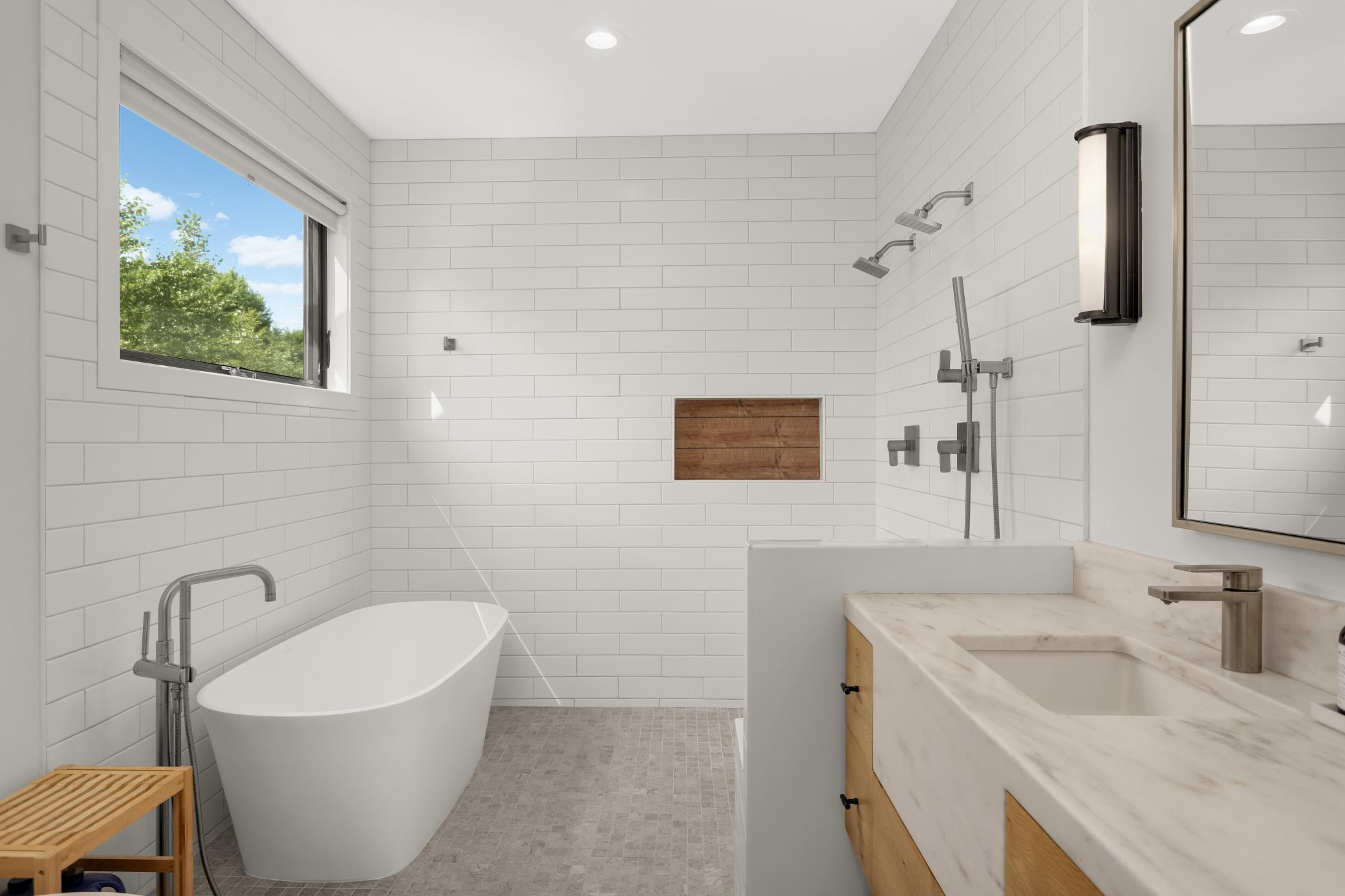 A true spa bath with solid marble soaking tub & oversized transom window