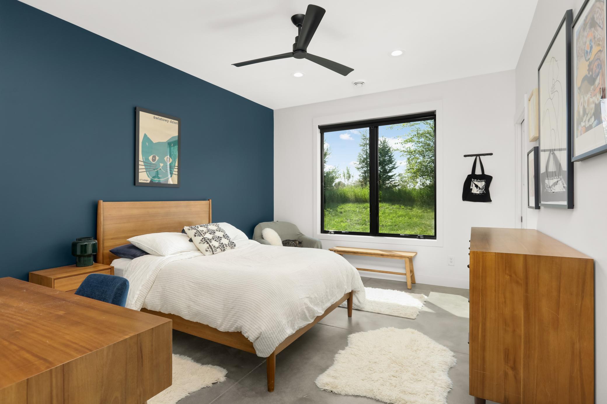 One of two other bedrooms with ceiling fan and walk-in closet