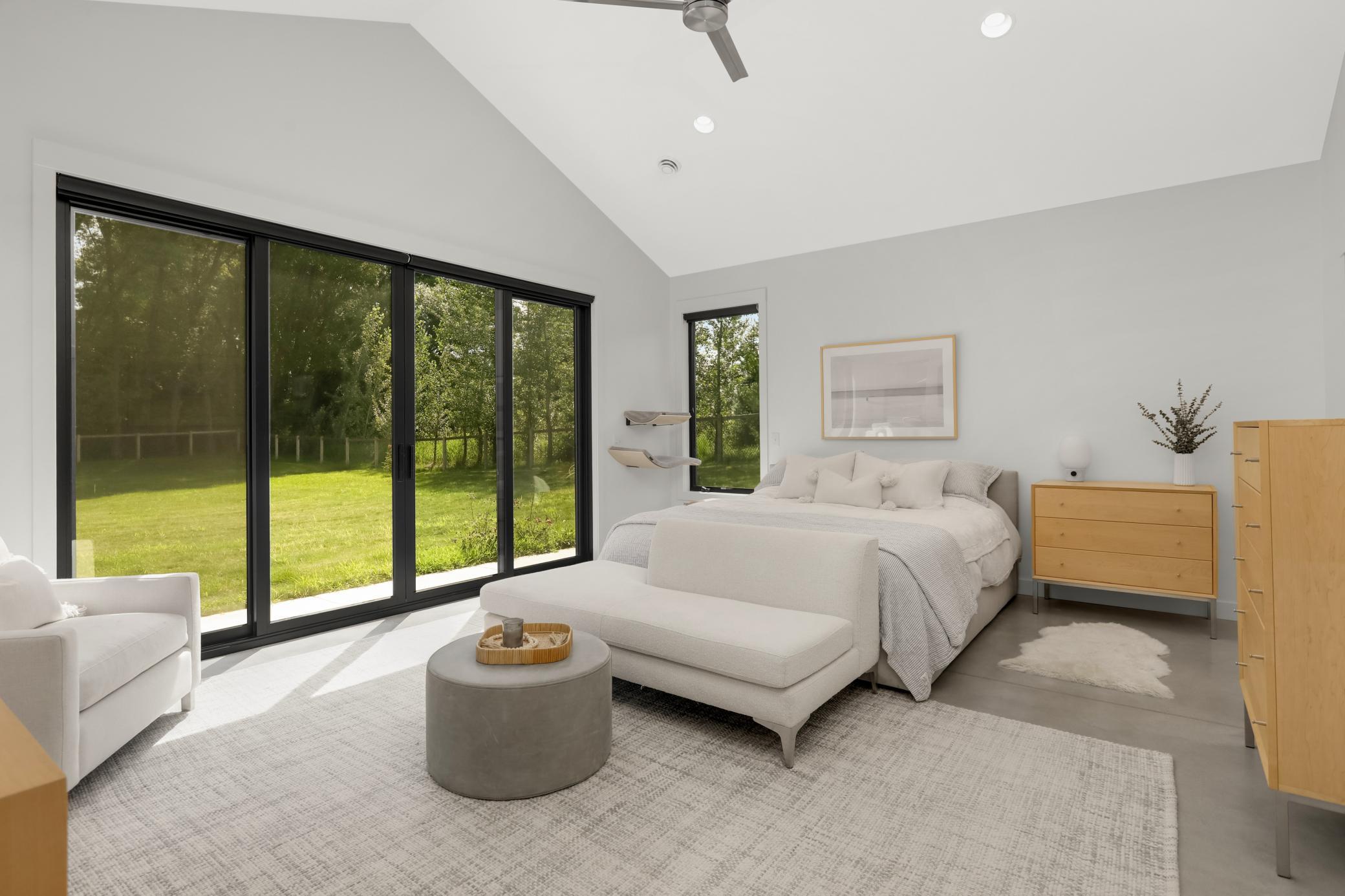 Two sets of 8 foot Anderson sliding doors bring in the sunshine