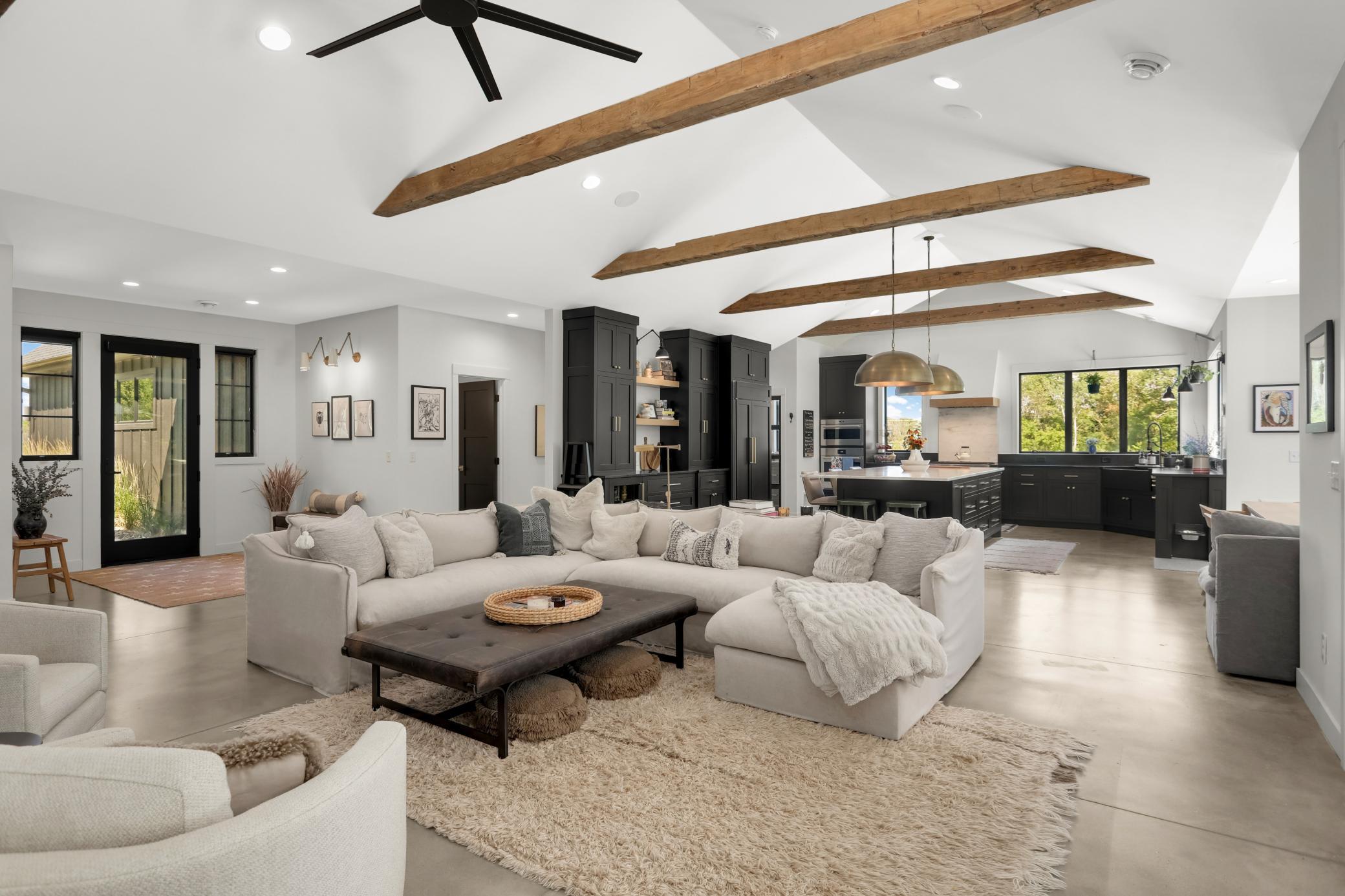 350 lb reclaimed beams from Oregon extend throughout the kitchen and living room