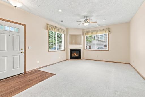Bright Living Room with Gas Fireplace and Ceiling Fan