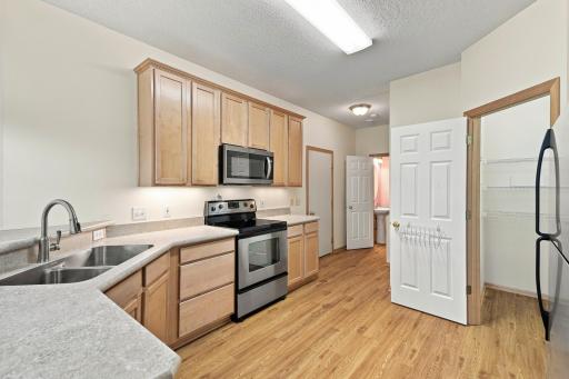 Kitchen with Over the Counter Lighting and Walk-in Pantry