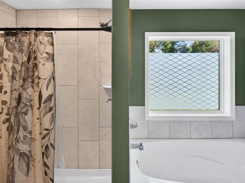 Seperate soaking tub and tiled shower