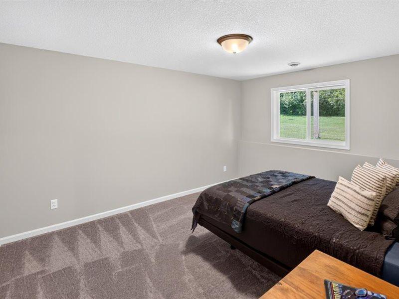 Bedroom number five located off the family room