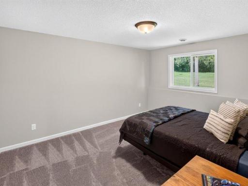Bedroom number five located off the family room