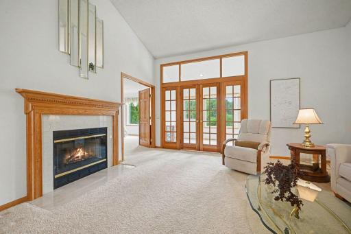 Gas Fireplace French Doors w/sidelights and transom - Double Doors lead to Primary Bedroom
