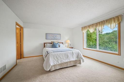 Primary Bedroom - Shown with a Q bed. No shared wall.