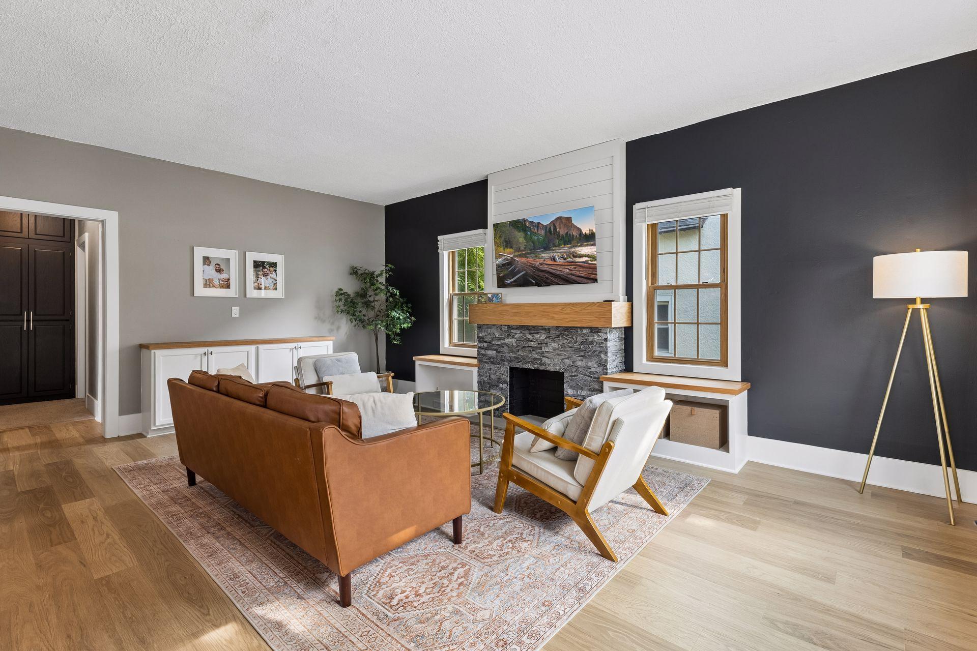 Spacious living room with new flooring and gorgeous fireplace