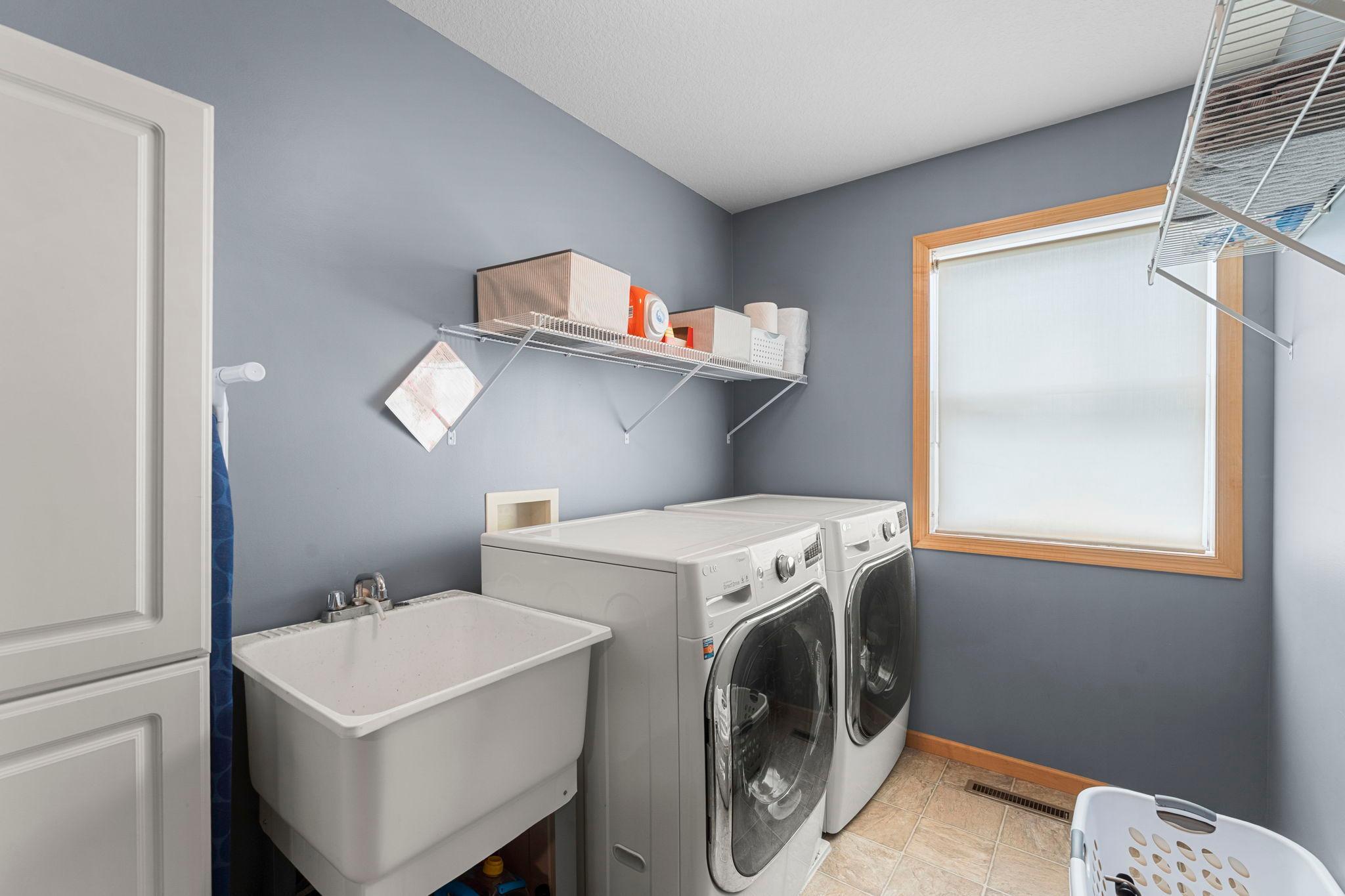 A conveniently located upper-level laundry room completes the floor.