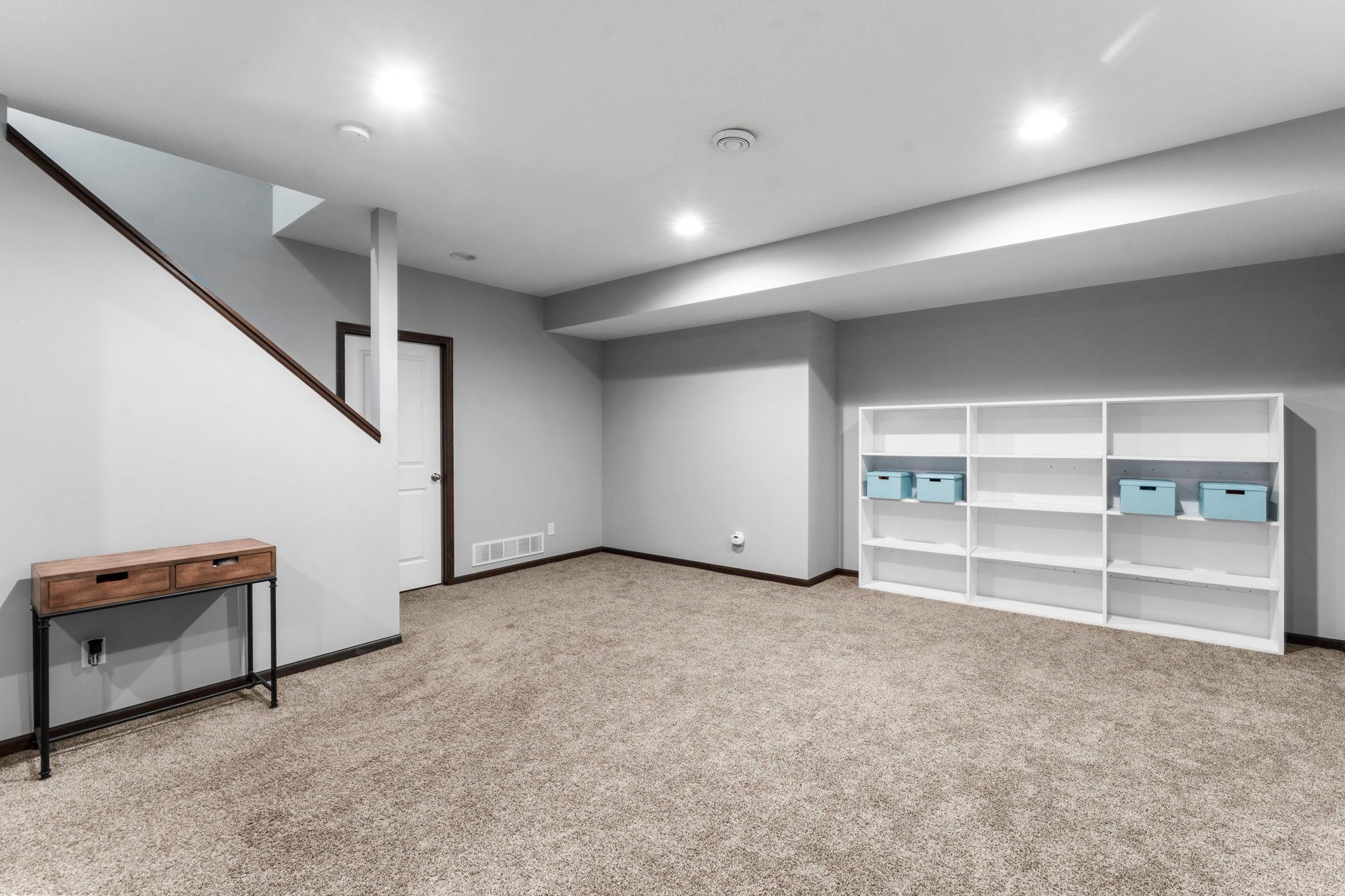 A view of the large recreation area, offering a versatile space for entertaining, relaxing, or hobbies.