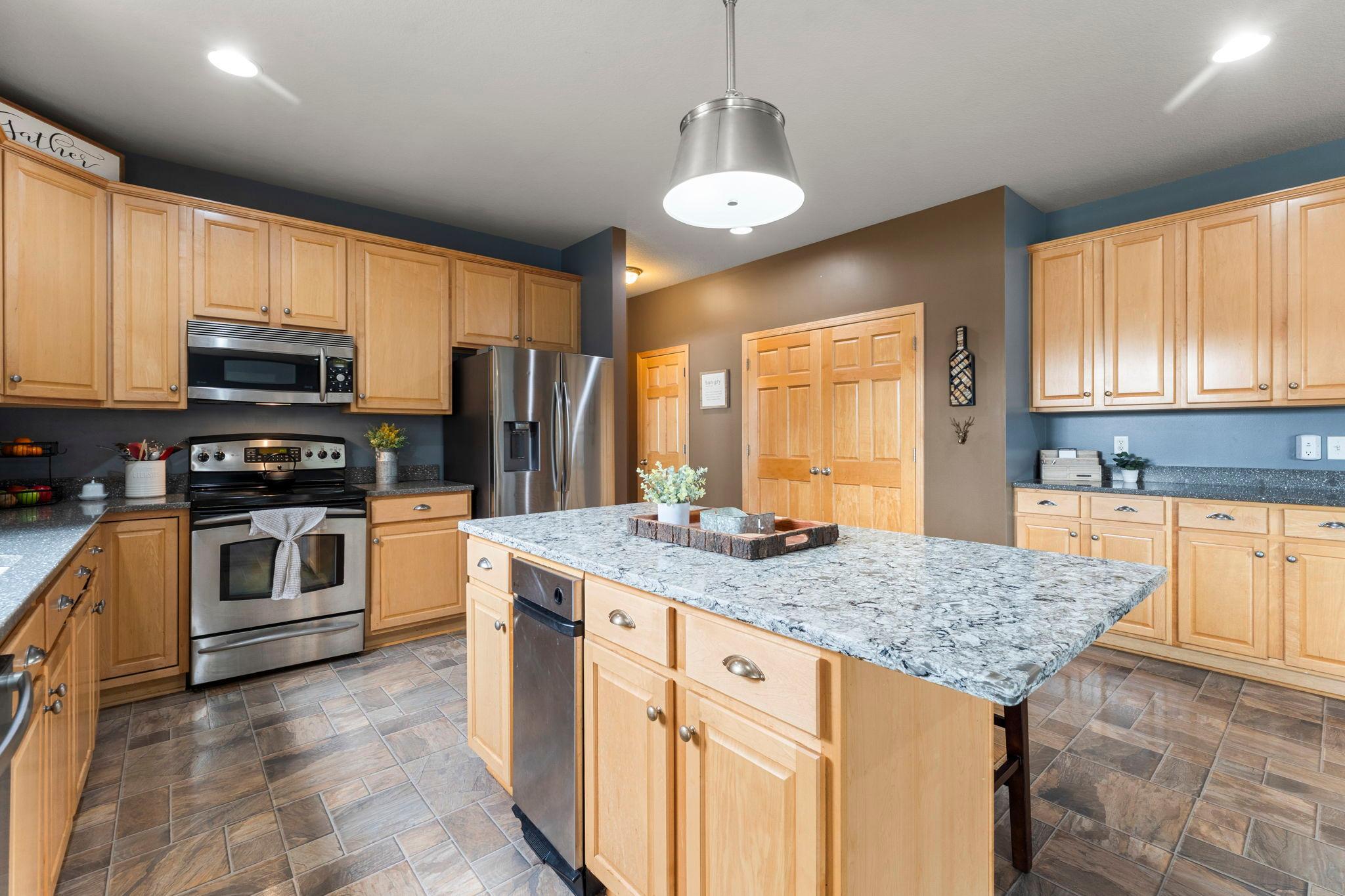 The spacious kitchen also offers a convenient, large pantry closet.