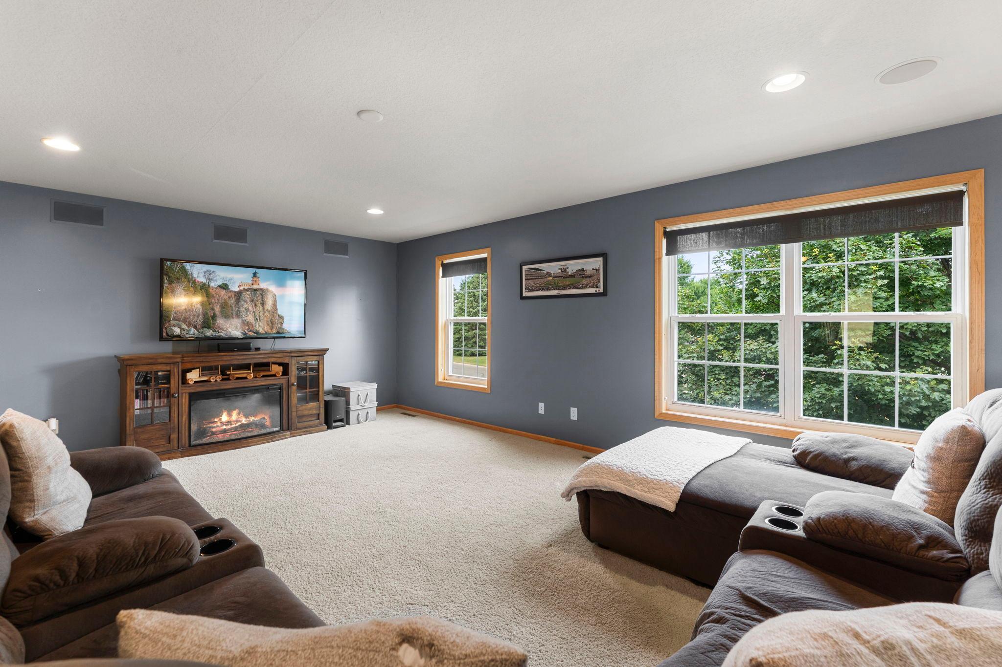 A spacious upper level loft area provides additional living space, perfect for a secondary family room, playroom, or flexible workspace.