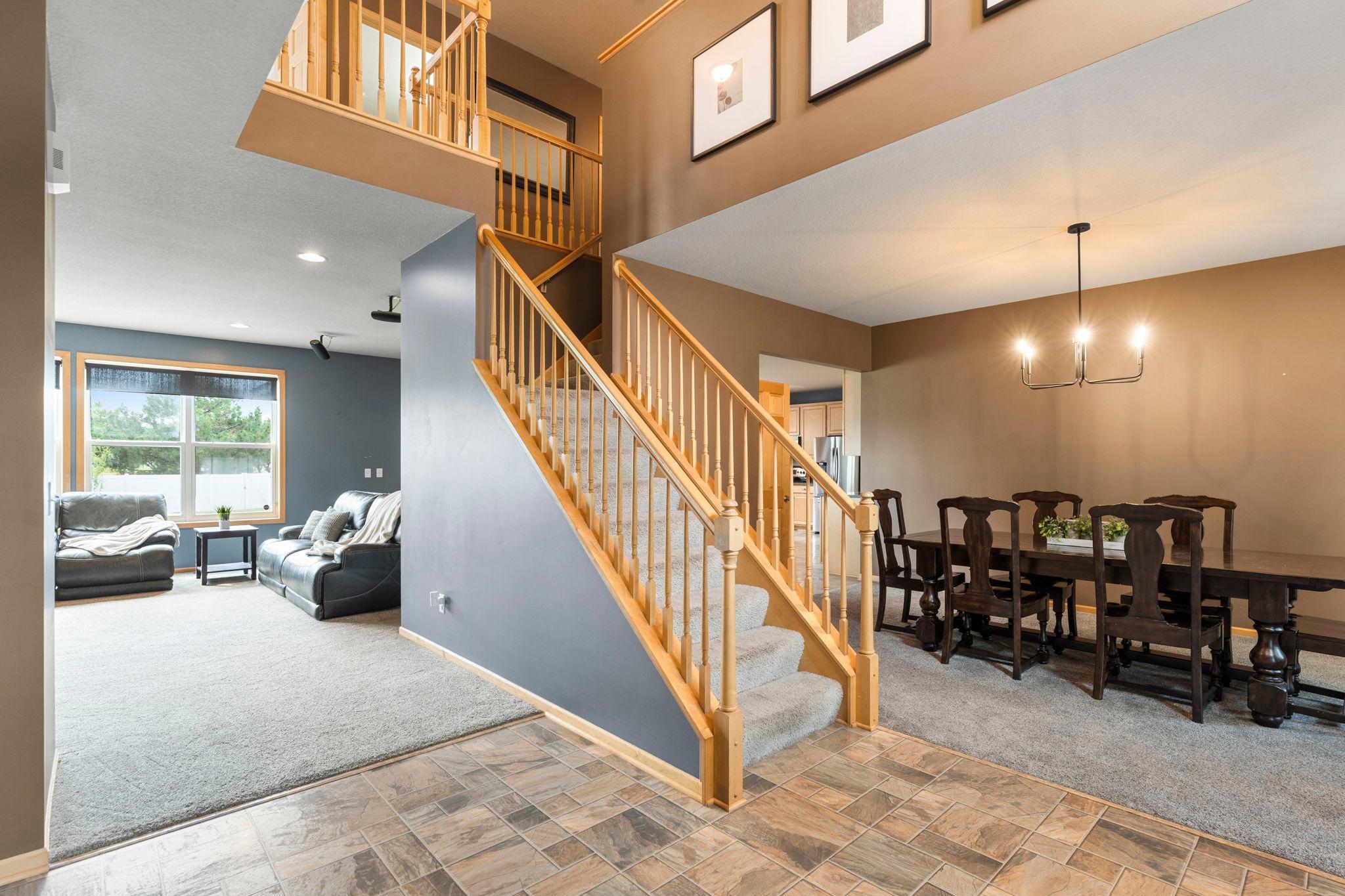 Step inside to a welcoming open-concept layout with soaring 9-foot ceilings, abundant natural light, and thoughtful spaces designed for both everyday living and entertaining.