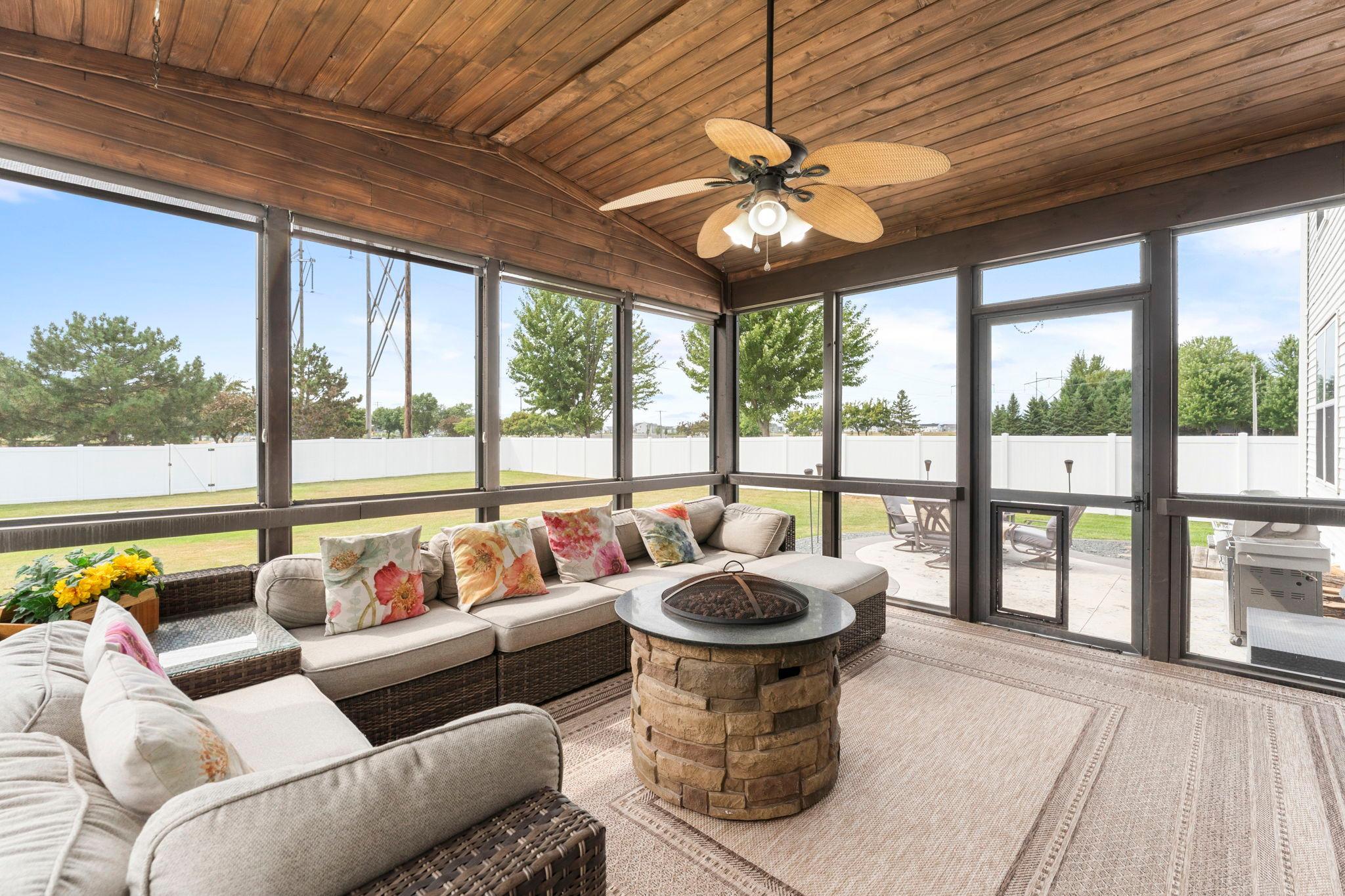 Featuring a ceiling fan and a bug-free space to relax, this porch is perfect for enjoying morning coffee, evening sunsets, or entertaining guests.