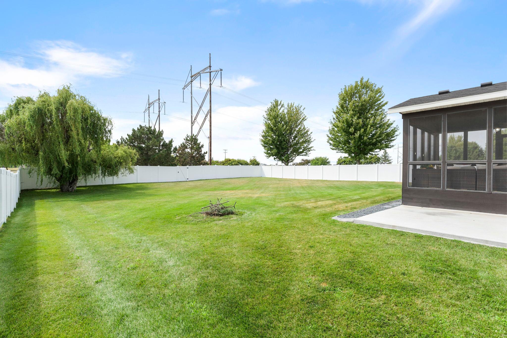 The backyard of this home is a standout feature, offering privacy with a fully fenced yard and plenty of room for outdoor enjoyment.