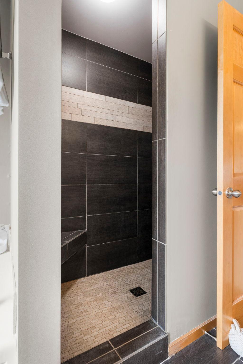Enjoy the spacious walk-in tile shower in the primary bath.