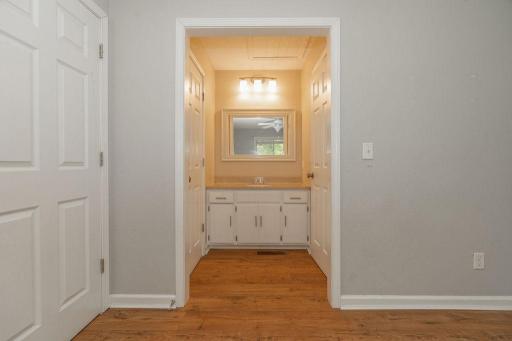 Ensuite vanity area leads to a full bath on the left & walk in closet on the right!