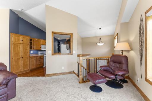 The layout seamlessly connects the living room with the kitchen and dining areas.