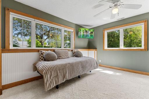 Additional bedroom with multiple windows bringing in an abundance of natural light.