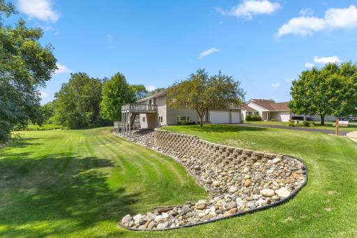 Landscaped retaining wall creates an attractive outdoor setting.