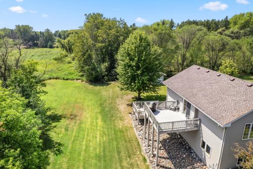 The home backs to an impressive stretch of green space for an open and peaceful backyard setting.